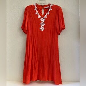 Casual flowy knee length dress with embroidered v-neck.